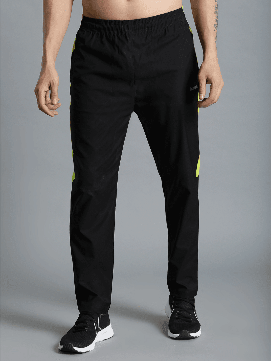 Harold Solid Regular fit Polyester Trackpants for Men with zipper pockets Comfortable Breathable Fabric Stretchable for Everyday Use Ideal for Yoga Training Gym Running or Performance - Hummel India