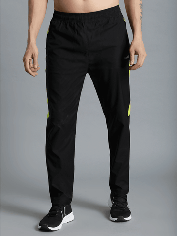 Harold Solid Regular fit Polyester Trackpants for Men with zipper pockets Comfortable Breathable Fabric Stretchable for Everyday Use Ideal for Yoga Training Gym Running or Performance - Hummel India