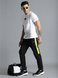 Harold Solid Regular fit Polyester Trackpants for Men with zipper pockets Comfortable Breathable Fabric Stretchable for Everyday Use Ideal for Yoga Training Gym Running or Performance - Hummel India