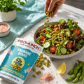 Professional enjoying PROMUNCH Roasted Edamame Beans at work